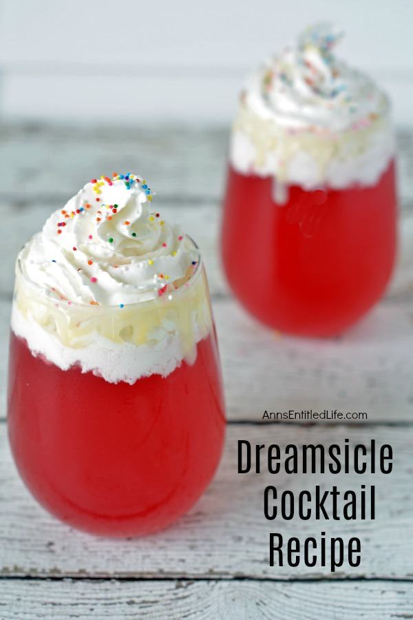 two, staggered, dreamsicle cocktail drinks in low, clear glasses, against a blue background