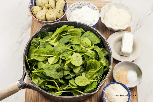 Fresh Spinach Artichoke Hot Dip Recipe. This easy to make spinach and artichoke dip recipe takes the classic spinach dip to a whole new level. Made with cream cheese, sour cream, spinach, and artichoke hearts, this dip is perfect for your next party, to serve as an appetizer, or as a game day snack! If you are looking to up your dip-game try this amazing spinach and artichoke dip. Your friends and family will love it!