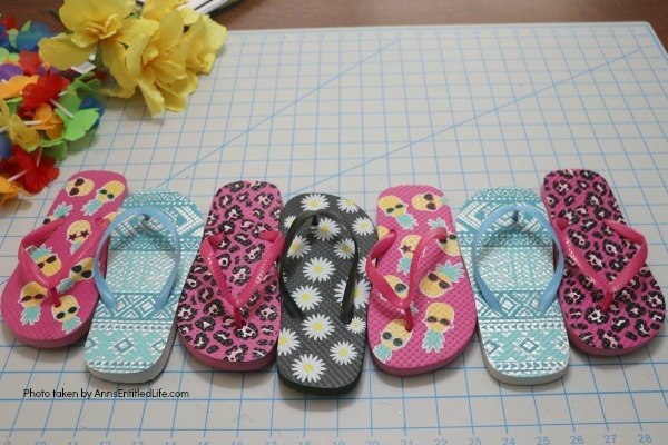 Flip Flops Door Hanger: Dollar Store Craft. Make this cute flip flop door hanger in no time flat with materials found at your local dollar store! This quick and easy project is inexpensive and great for summertime, tropical parties, or classroom decorations.