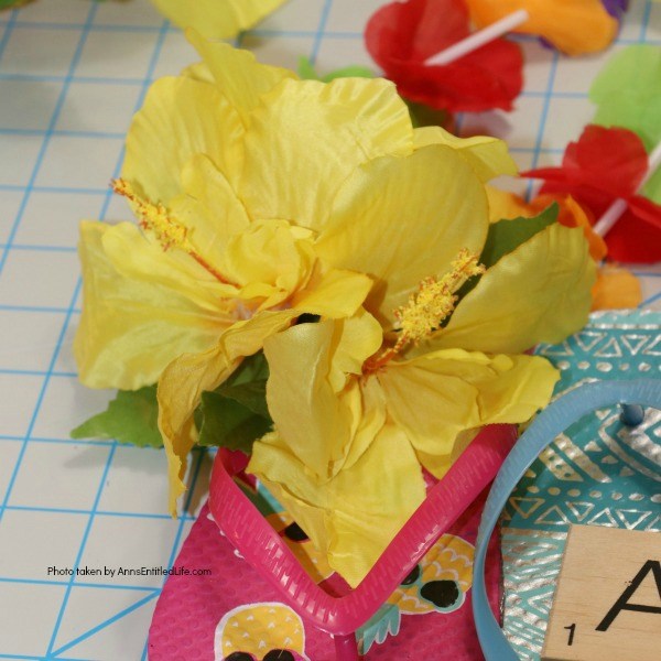 Flip Flops Door Hanger: Dollar Store Craft. Make this cute flip flop door hanger in no time flat with materials found at your local dollar store! This quick and easy project is inexpensive and great for summertime, tropical parties, or classroom decorations.