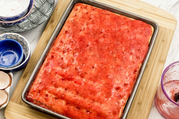 Strawberry Vanilla Poke Cake Recipe. This old fashioned, from scratch, vanilla poke cake uses fresh, homemade strawberry syrup for a natural fruity taste. This from scratch cake is easier to make than you think! Make this delicious strawberry vanilla poke cake recipe today!