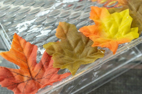 Autumn Leaf Napkin Holder: Dollar Store Craft. If you are looking for a fun, easy to make fall craft to dress up your kitchen counter or table, make this simple fall foliage napkin holder! Filled with acorns, leaves, and fall flowers, you can effortlessly make some autumn decor to make your house part of the fall season.