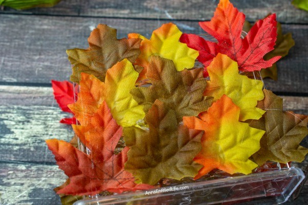 Autumn Leaf Napkin Holder: Dollar Store Craft. If you are looking for a fun, easy to make fall craft to dress up your kitchen counter or table, make this simple fall foliage napkin holder! Filled with acorns, leaves, and fall flowers, you can effortlessly make some autumn decor to make your house part of the fall season.