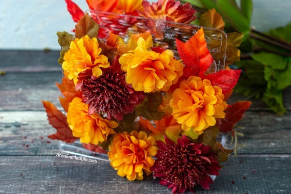 Autumn Leaf Napkin Holder: Dollar Store Craft. If you are looking for a fun, easy to make fall craft to dress up your kitchen counter or table, make this simple fall foliage napkin holder! Filled with acorns, leaves, and fall flowers, you can effortlessly make some autumn decor to make your house part of the fall season.