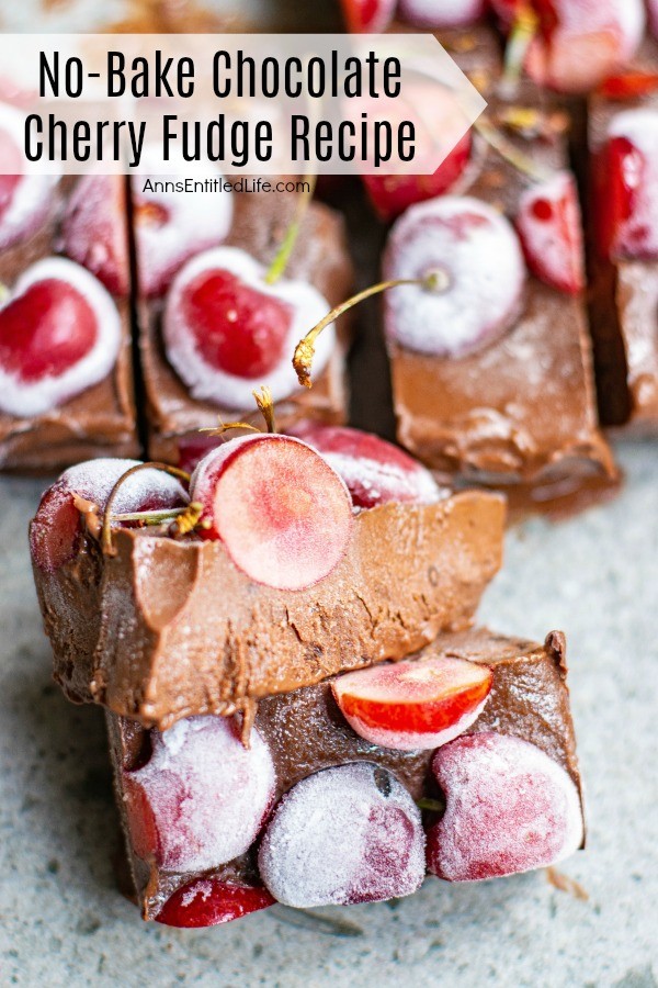 A close-up of cut piece of fresh cherry chocolate fudge shown on  the bias, The rest of the cut fudge is in the background.