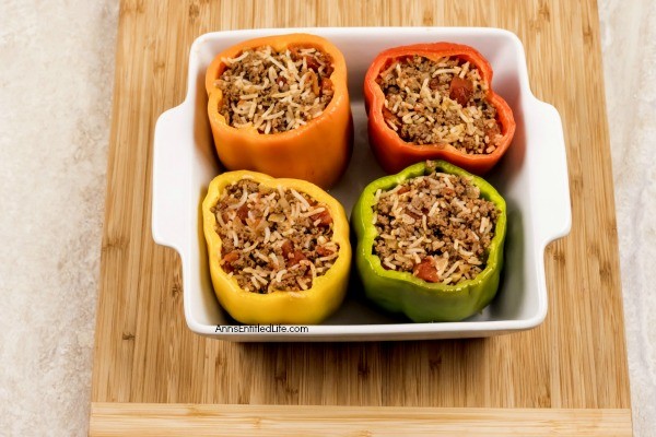 Stuffed Bell Peppers Recipe. These stuffed bell peppers are a classic recipe. Made with a mixture ground beef, rice, onions, tomatoes, and spices, this easy to make bell peppers recipe is the perfect family dinner any time of year!