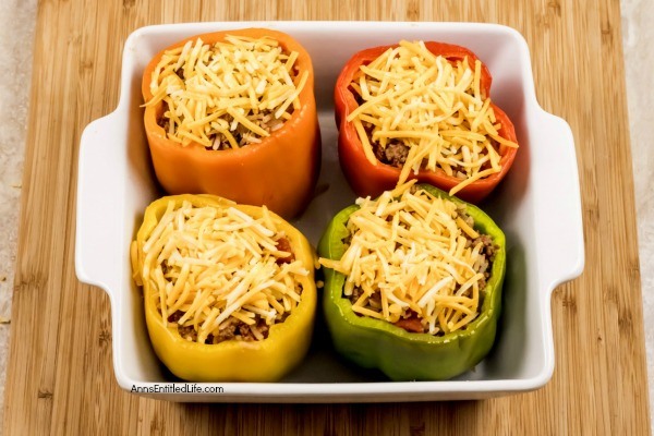 Stuffed Bell Peppers Recipe. These stuffed bell peppers are a classic recipe. Made with a mixture ground beef, rice, onions, tomatoes, and spices, this easy to make bell peppers recipe is the perfect family dinner any time of year!