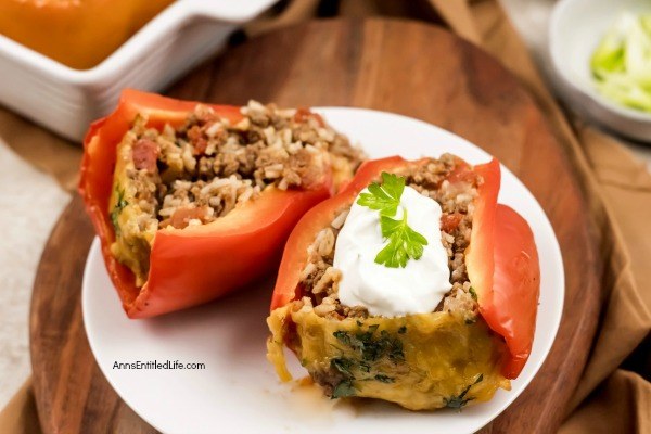 Stuffed Bell Peppers Recipe. These stuffed bell peppers are a classic recipe. Made with a mixture ground beef, rice, onions, tomatoes, and spices, this easy to make bell peppers recipe is the perfect family dinner any time of year!