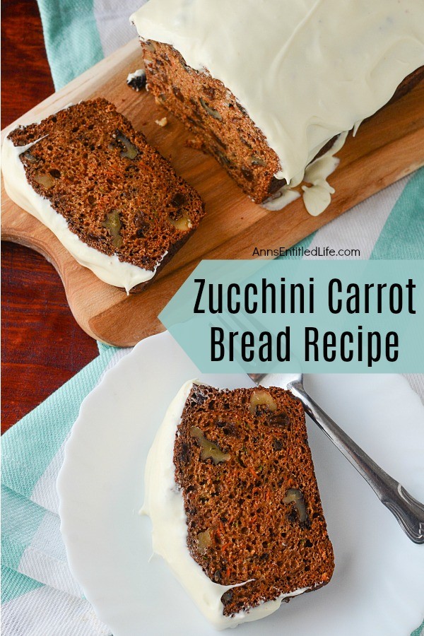 frosted zucchini carrot bread on a white plate with fork, remaining loaf on a butcher block cutting board