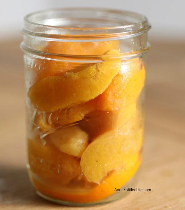 Canned Drunken Vanilla Bourbon Peaches Recipe. Canning peaches is a delicious way to preserve your fresh fruit peaches to eat when the peach season is over. This terrific drunken vanilla bourbon peaches water bath canning recipe is a great way to process your peaches. Can now, enjoy later! 