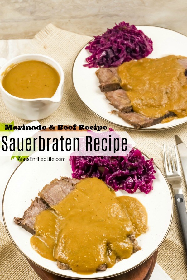 A white plate filled with a serving of sauerbraten, gravy, and Pennsylvania red cabbage on a brown placemat, a second plate is in the upper right, a boat of gravy is in the upper left