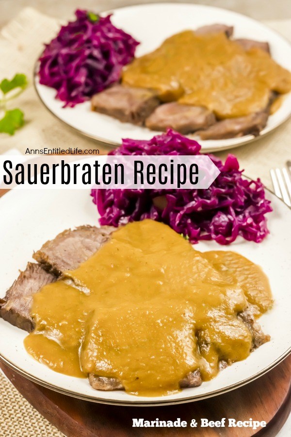 A white plate filled with a serving of sauerbraten, gravy, and Pennsylvania red cabbage on a brown placemat, a second plate is seen in the upper right