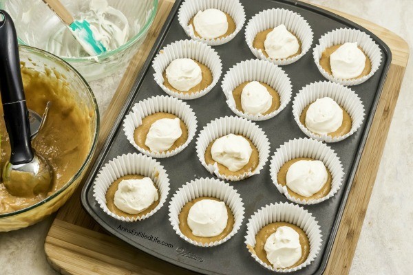 Pumpkin Cheesecake Cupcakes Recipe. Now that the weather has turned cooler, it is pumpkin season! These terrific cheesecake filled pumpkin cupcakes are frosted with an easy to make, complimentary brown sugar butter cream frosting. Whip up a batch tonight for lunchboxes, after-school snack, or dessert.