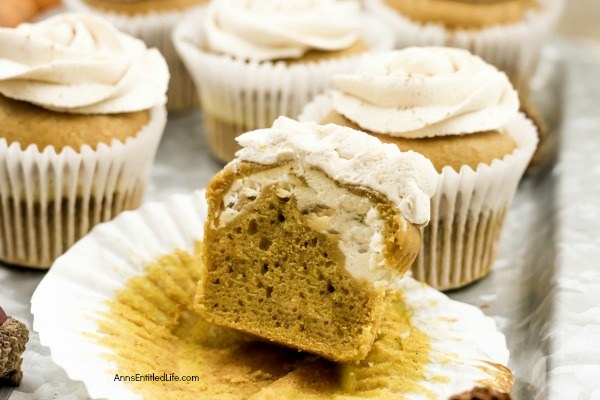 Pumpkin Cheesecake Cupcakes Recipe. Now that the weather has turned cooler, it is pumpkin season! These terrific cheesecake filled pumpkin cupcakes are frosted with an easy to make, complimentary brown sugar buttercream frosting. Whip up a batch tonight for lunchboxes, after-school snack, or dessert.