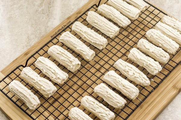 Rum Logs Recipe. Delicious, light and a touch sweet, these Rum Logs are a festive, melt-in-your mouth holiday cookie your entire family will enjoy. Perfect on a cookie tray or when you want a light sweet treat, this rum logs recipe is easy to make and requires no chill time for the dough!