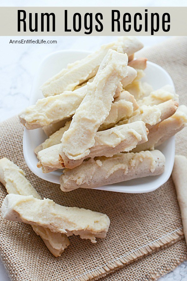 Close-up photo of a white plate filled with rum log cookies sitting on a brown placemat.