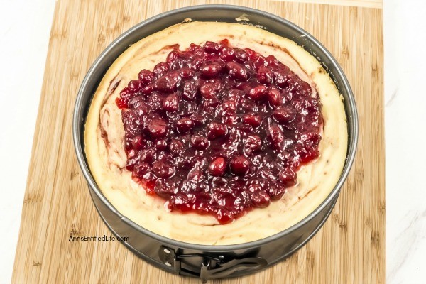 Cranberry Sauce Cheesecake Recipe. This delicious cheesecake is perfect for holiday dinners, parties, and get-togethers. It is a creamy and delectable cheesecake, with just a touch of tartness and spice from the gingerbread crust. Go ahead, delight your taste buds with this Cranberry Sauce Cheesecake this holiday season!