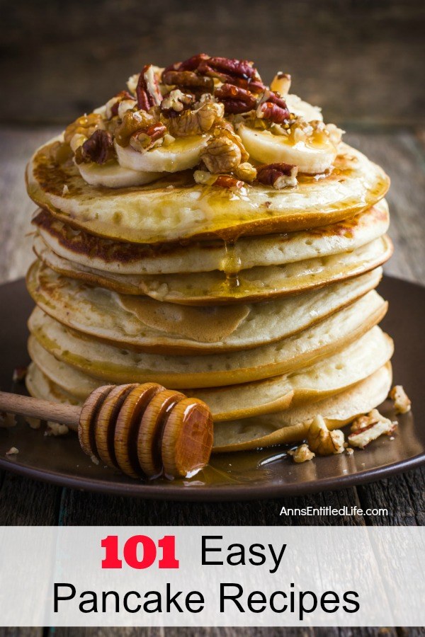 a stack of banana nut pancakes smothered in honey, on a dark plate set against a dark background.