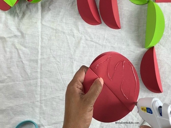 Paper Christmas Ornaments DIY. These paper Christmas ornaments are the easiest homemade ornaments you could make! Fully customizable to match any color scheme and they can be made as full or as slim as you like, these ornaments take about 5-minutes to make.