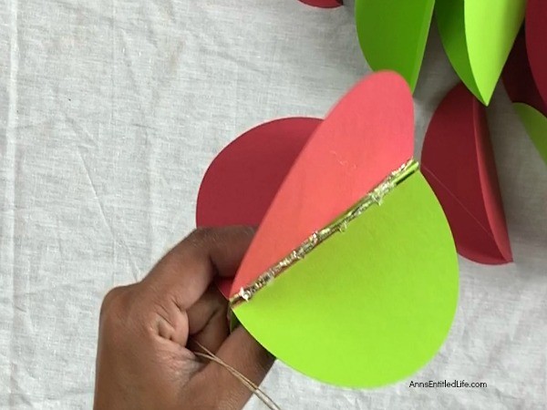 Paper Christmas Ornaments DIY. These paper Christmas ornaments are the easiest homemade ornaments you could make! Fully customizable to match any color scheme and they can be made as full or as slim as you like, these ornaments take about 5-minutes to make.