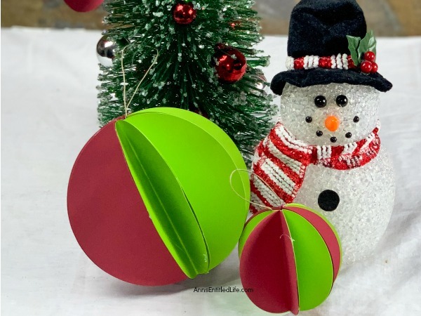Paper Christmas Ornaments DIY. These paper Christmas ornaments are the easiest homemade ornaments you could make! Fully customizable to match any color scheme and they can be made as full or as slim as you like, these ornaments take about 5-minutes to make.