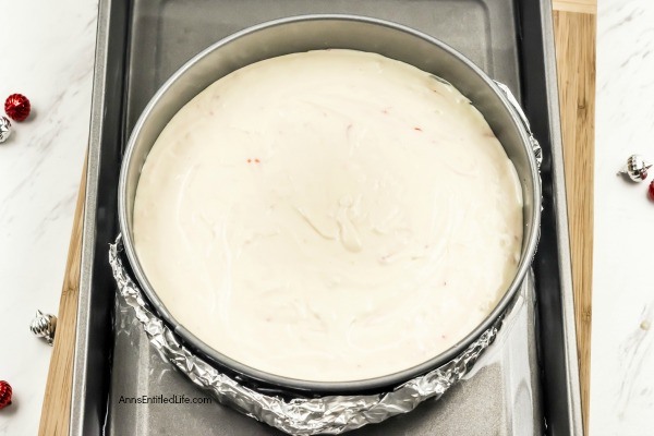 Candy Cane Cheesecake Recipe. Make a classic flavor of the holidays even better by preparing and serving this Candy Cane Cheesecake recipe for your friends and family! It has a cool, minty taste paired with a creamy cheesecake base. Topped off with chocolate drizzle and pieces of candy cane, this candy cane cheesecake has a picture perfect presentation.
