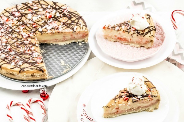 Candy Cane Cheesecake Recipe. Make a classic flavor of the holidays even better by preparing and serving this Candy Cane Cheesecake recipe for your friends and family! It has a cool, minty taste paired with a creamy cheesecake base. Topped off with chocolate drizzle and pieces of candy cane, this candy cane cheesecake has a picture perfect presentation.