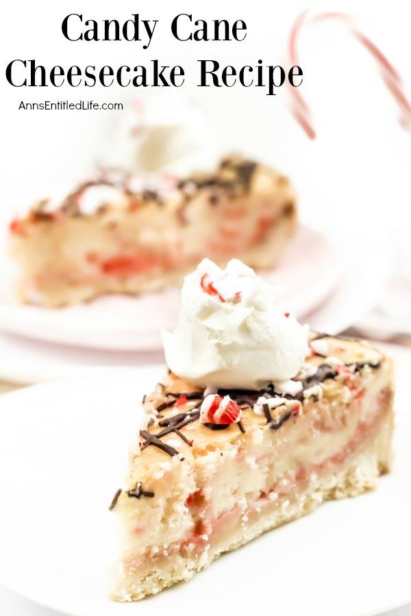 A close-up of a piece of candy cane cheesecake on a white plate. A second cut piece sits in the background.