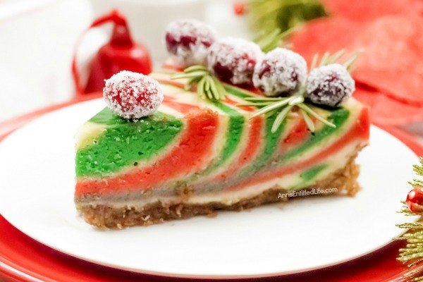 Christmas Cheesecake Recipe. Impress your friends and family with this gorgeous Christmas Cheesecake. You will delight your taste buds when you serve this dressed-up classic sour cream cheesecake recipe for the holidays. The beautiful swirls of color add a dash of magical wonder to match the holiday season and form a perfect holiday dessert.