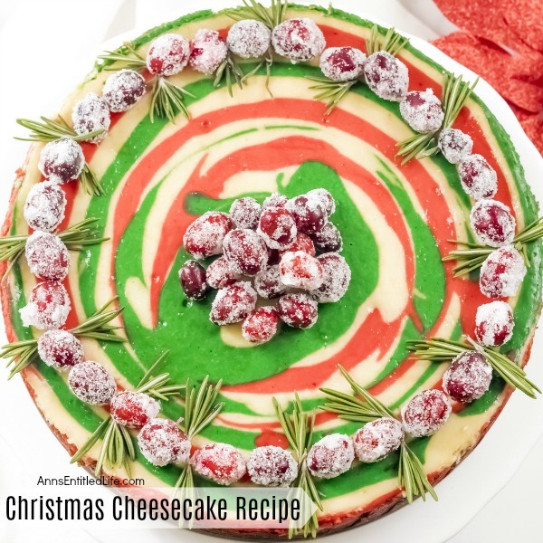 Christmas Cheesecake Recipe. Impress your friends and family with this gorgeous Christmas Cheesecake. You will delight taste buds when you serve this dressed-up classic sour cream cheesecake recipe for the holidays. The wonderful swirls of color add a dash of magical wonder to match the holiday season and form a perfect holiday dessert.