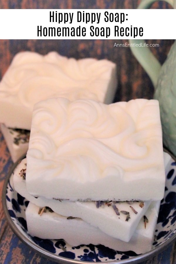 a stack of three homemade soaps on a blue plate, there is another soap in the background