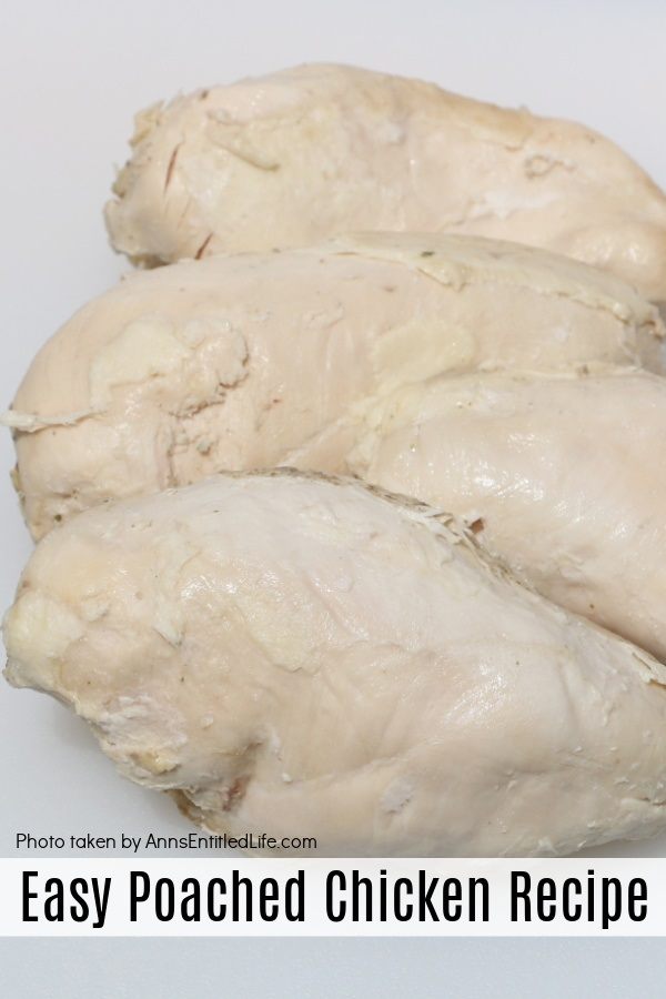 4 pieces of poached chicken sitting on a white cutting board