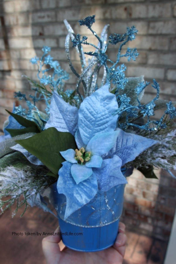 Winter Ice Blue Bucket Craft. This happy little winter ice blue bucket craft comes together quickly and easily for a sweet little side table decor piece that is perfect for the winter season. I have this in my foyer to give the endurance a pop of color for the winter season.