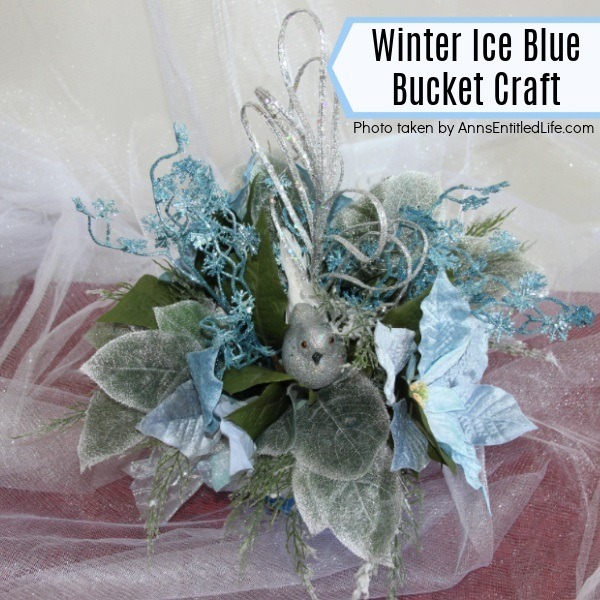 Winter Ice Blue Bucket Craft. This happy little winter ice blue bucket craft comes together quickly and easily for a sweet little side table decor piece that is perfect for the winter season. I have this in my foyer to give the endurance a pop of color for the winter season.