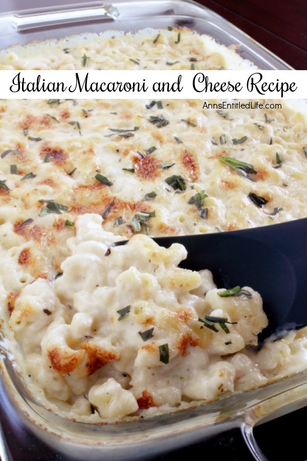 A pan of baked Italian style macaroni and cheese, a serving spoon is lifting out a portion directly from  the pan