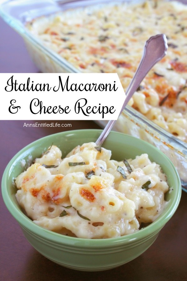 A green bowl is filled with a servings of Italian mac and cheese, a spoon sits inside the bowl. The pan of baked Italian style macaroni and cheese is in the background.