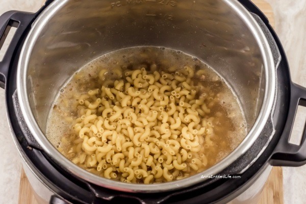 Instant Pot Macaroni and Cheese Recipe. You cannot go wrong with a classic dish like this instant pot macaroni and cheese recipe! Switch up your traditional way of making mac and cheese and forget the boxed version and make it with your Instant Pot instead. Full of gooey cheddar cheese, soft macaroni, and just the right spices, this dish is unforgettably delicious.