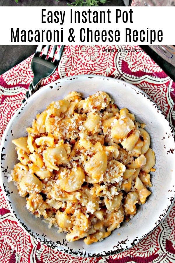 A servings of macaroni and cheese in a white bowl on a red and white placemat.