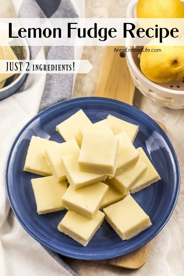 An overhead view of a blue plate filled with cut square of lemon fudge, there is a basket of fresh lemons to the right, more fudge in a blue bowl to the left.