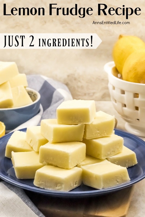 A side view of a blue plate filled with cut square of lemon fudge, there is a basket of fresh lemons to the right, more fudge in a blue bowl to the left.