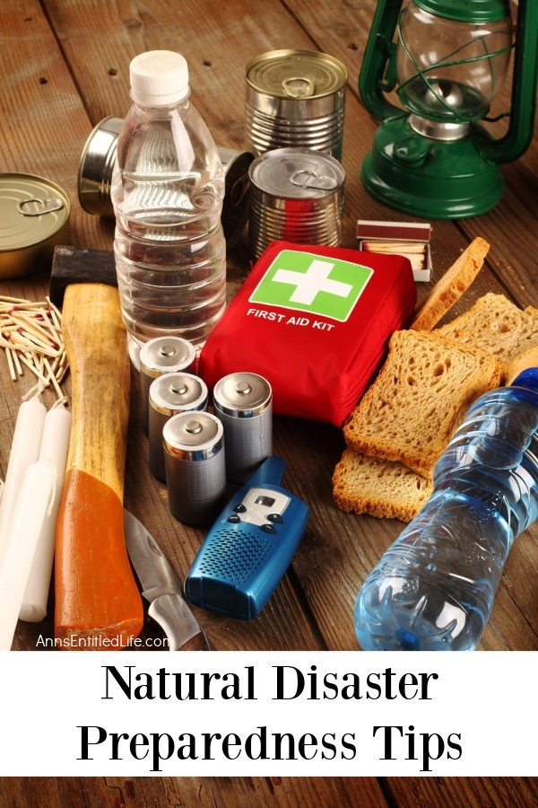 a plethora of natural disaster preparedness goods sitting on a brown bench