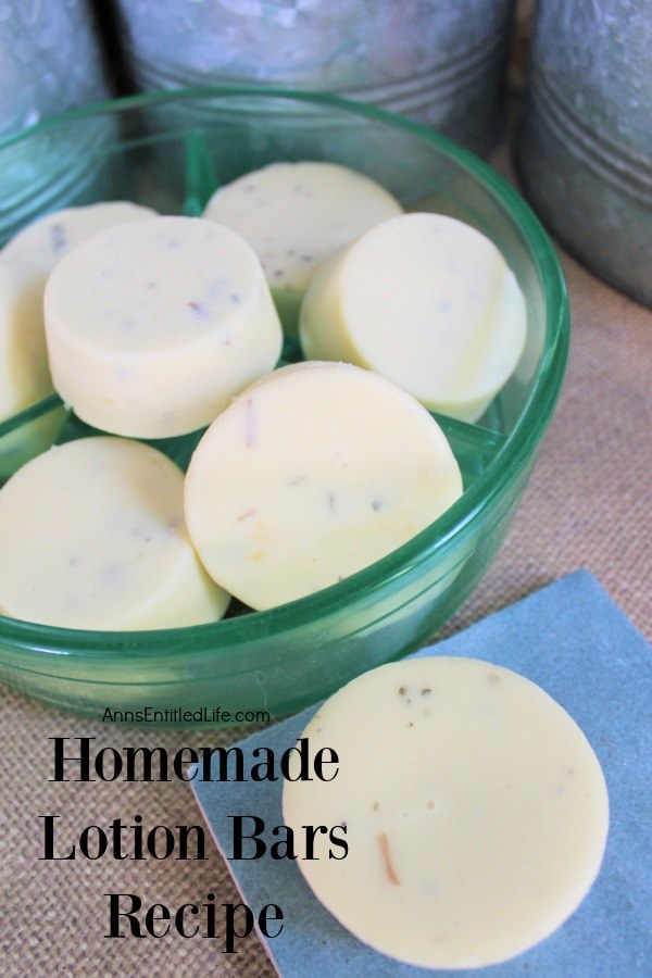 a clear bowl filled with homemade lotion bars is in the upper left, a single lotion bar is sitting on a blue pad in the front right