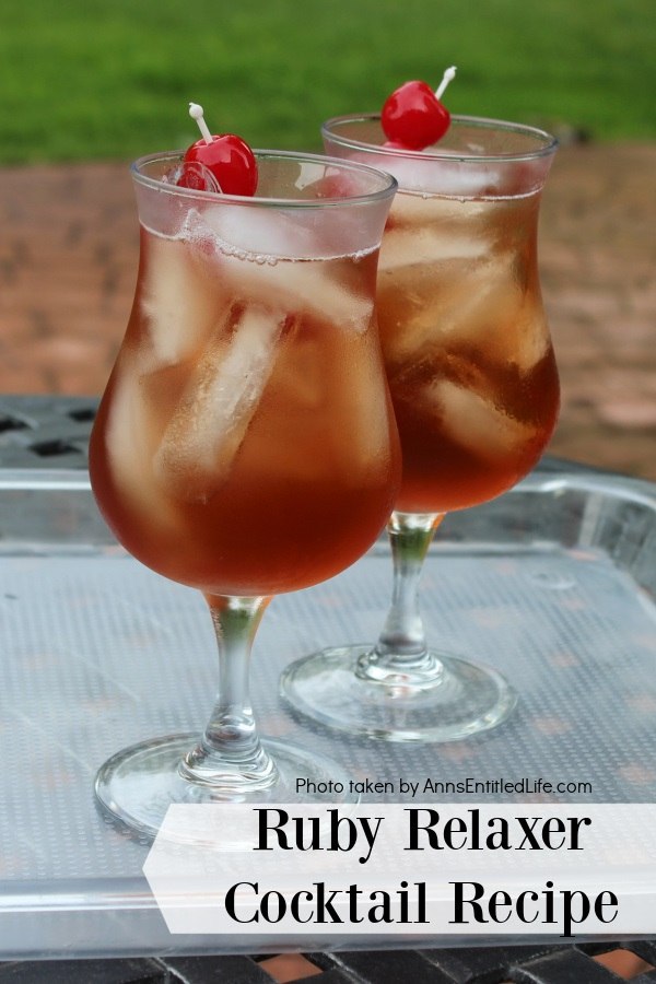 Two glasses of ruby relaxer cocktail set on a plastic tray in a backyard