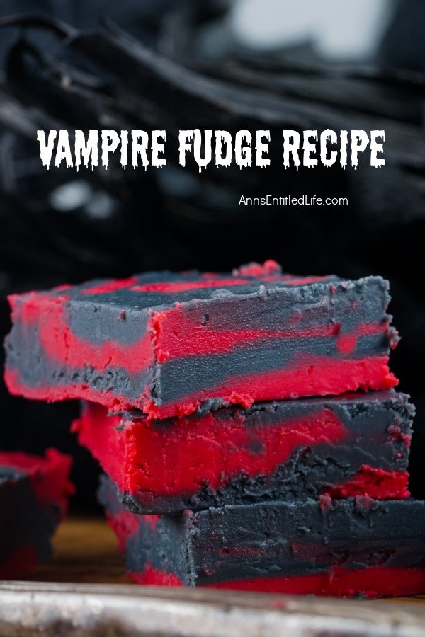 Three pieces of stacked red and black fudge set against a black background.