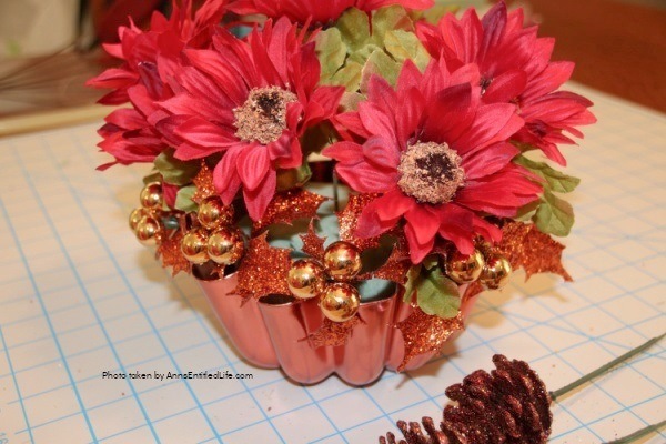 Vintage Copper Jello Mold Centerpiece. Using an old copper jello or baking mold as the base, make this beautiful centerpiece, perfect for your kitchen table or side table. Follow the step-by-step instructions to make this terrific centerpiece in about 15 minutes. You can fully customize this floral arrangement to match any decor or season.