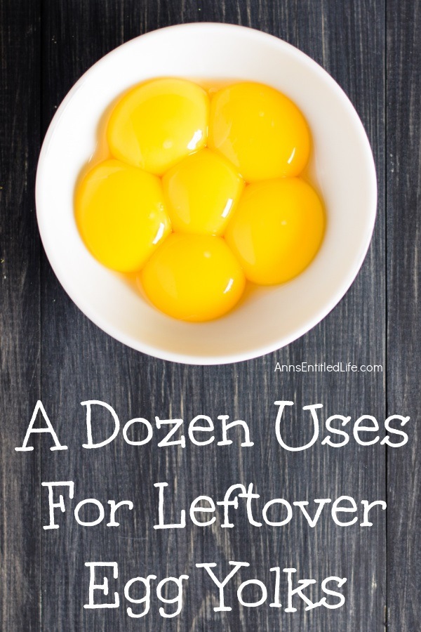 6 egg yolks on a white bowl against a brown background