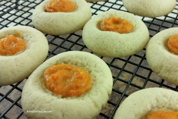 Pumpkin Cheesecake Thumbprint Cookies Recipe. If you like thumbprint cookies, you will love this delicious update to that old classic recipe. These Pumpkin Cheesecake Thumbprint Cookies combine the spicy taste of pumpkin with the smooth taste of cream cheese for a truly great cookie!