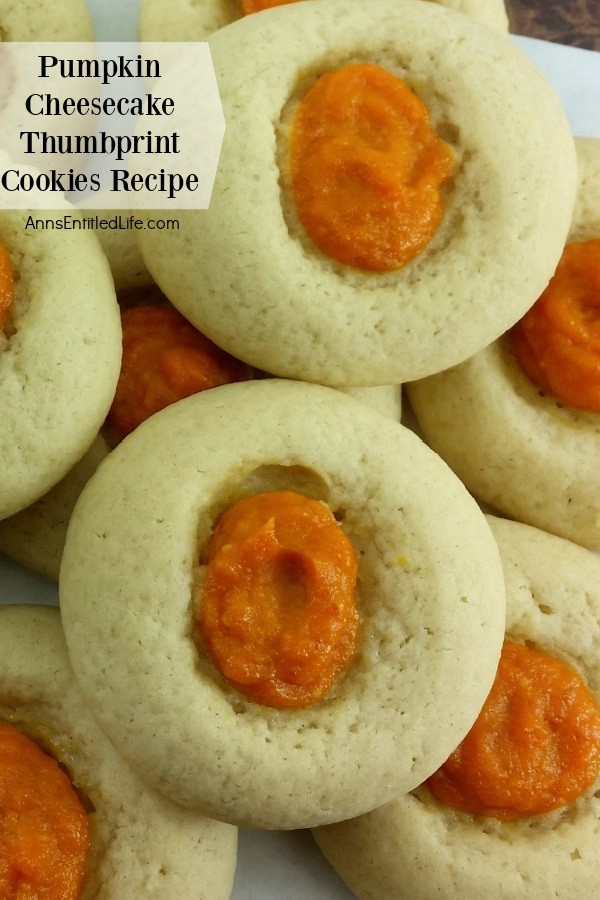 Upclose image of two Pumpkin Cheesecake Thumbprint Cookies with a layer of like cookies underneath 