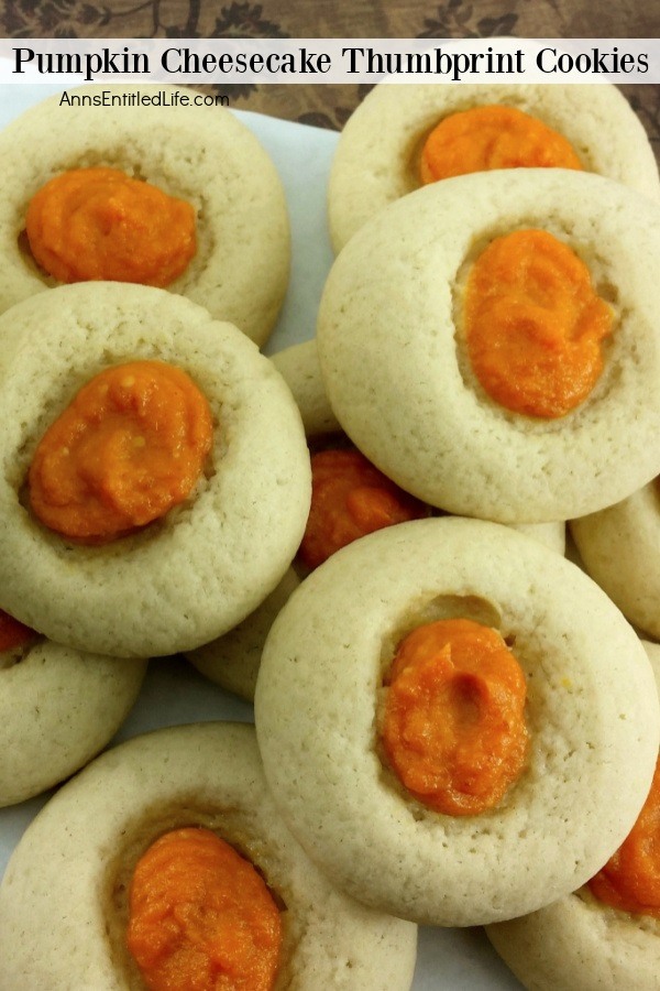 A white plate filled with Pumpkin Cheesecake Thumbprint Cookies