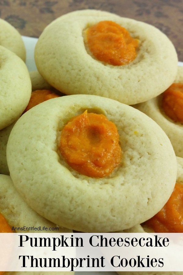 Upclose image of two Pumpkin Cheesecake Thumbprint Cookies with a layer of like cookies underneath 